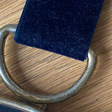 Vintage witch's eye curved mirror hangs velvet ribbon