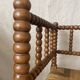 Corner chair in straw and turned wood, fireside chair.
