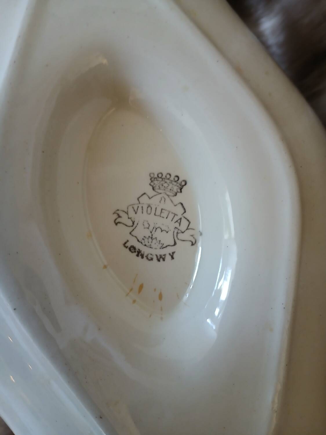 Antique sauce boat in Longwy ironstone.