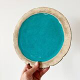 Ceramic trivet and bottle coaster from the 1950s.