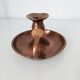 Set of a pair of candle holders and a hand candle holder