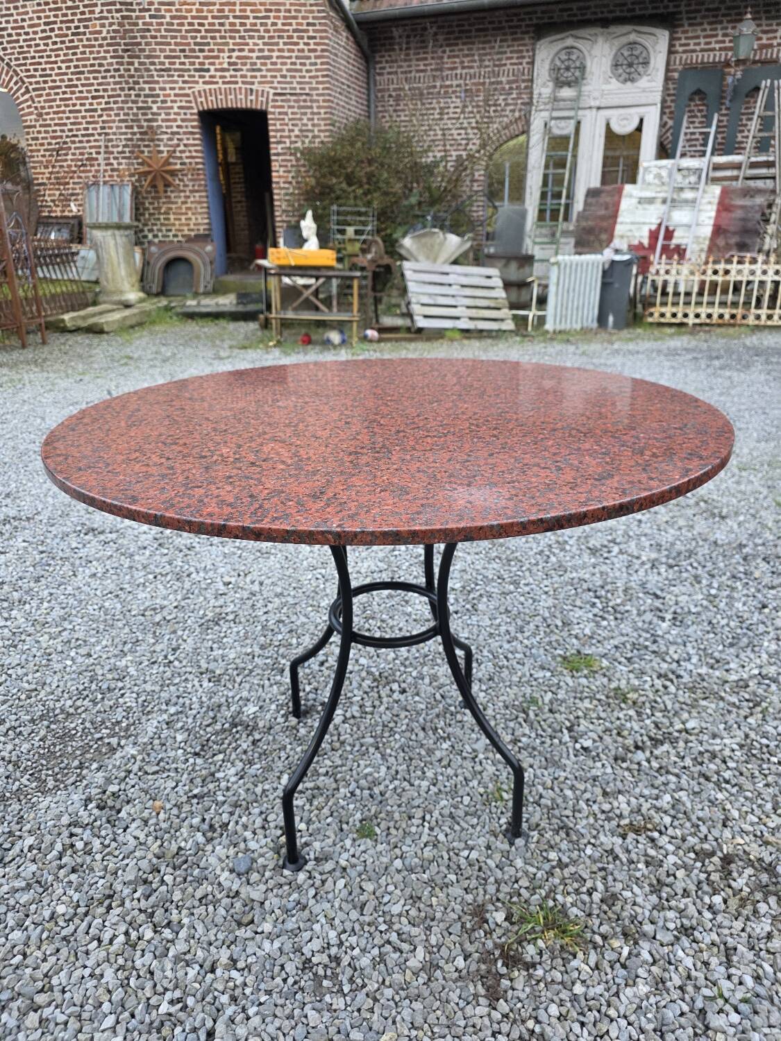Round marble table with wrought iron base from the mid-20th century.