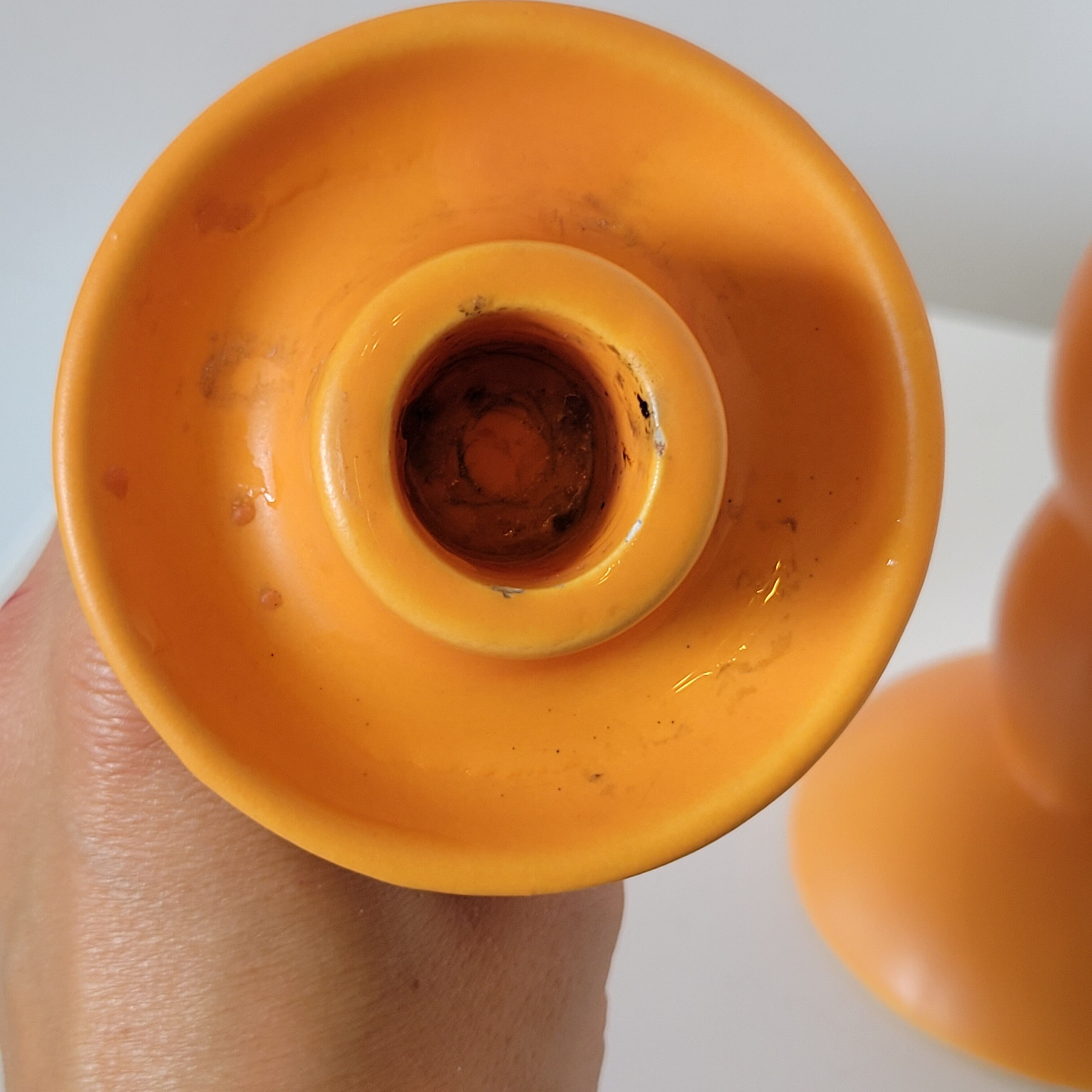 2 orange ceramic candle holders