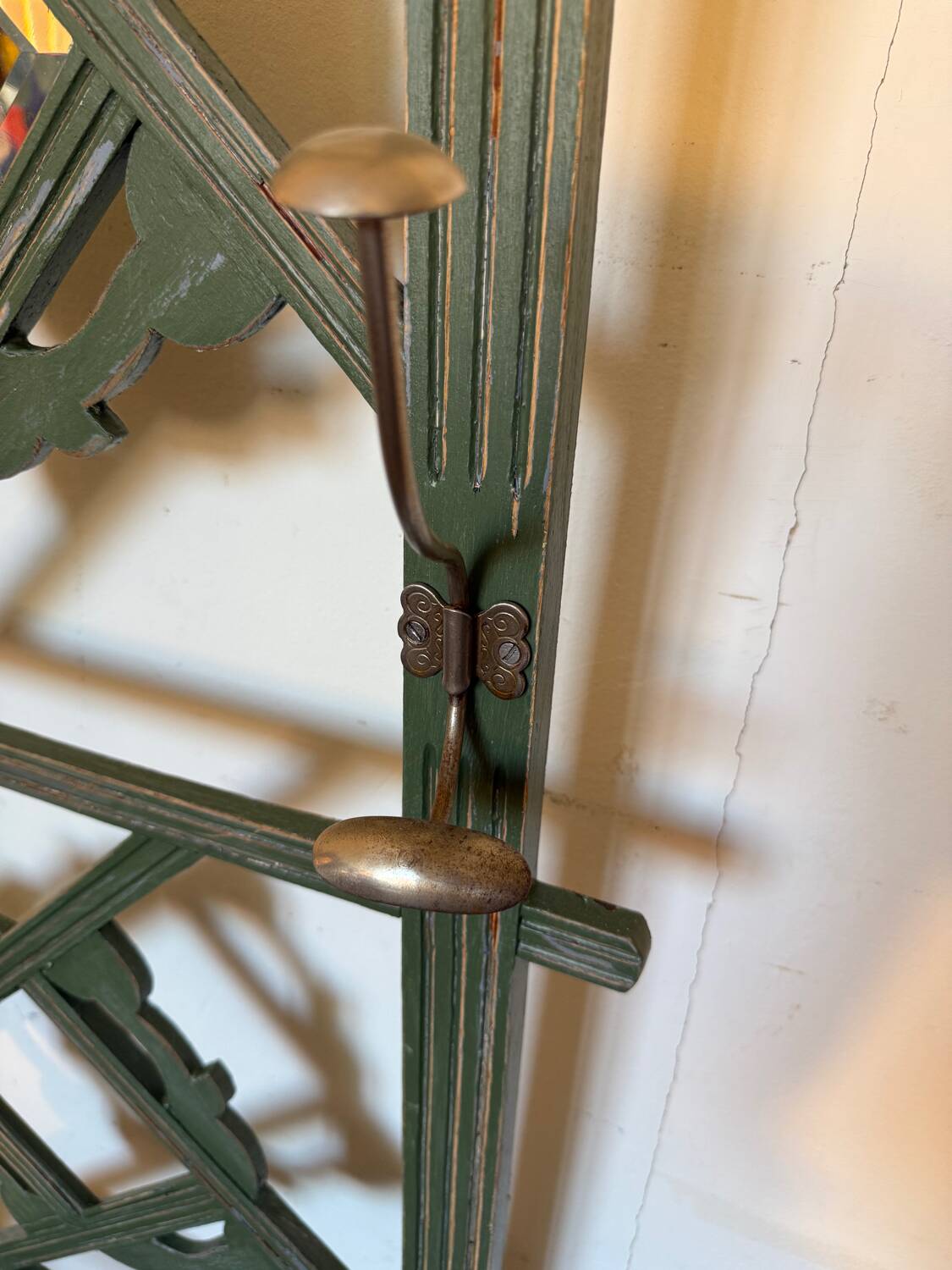 Art Deco coat rack in green patinated wood