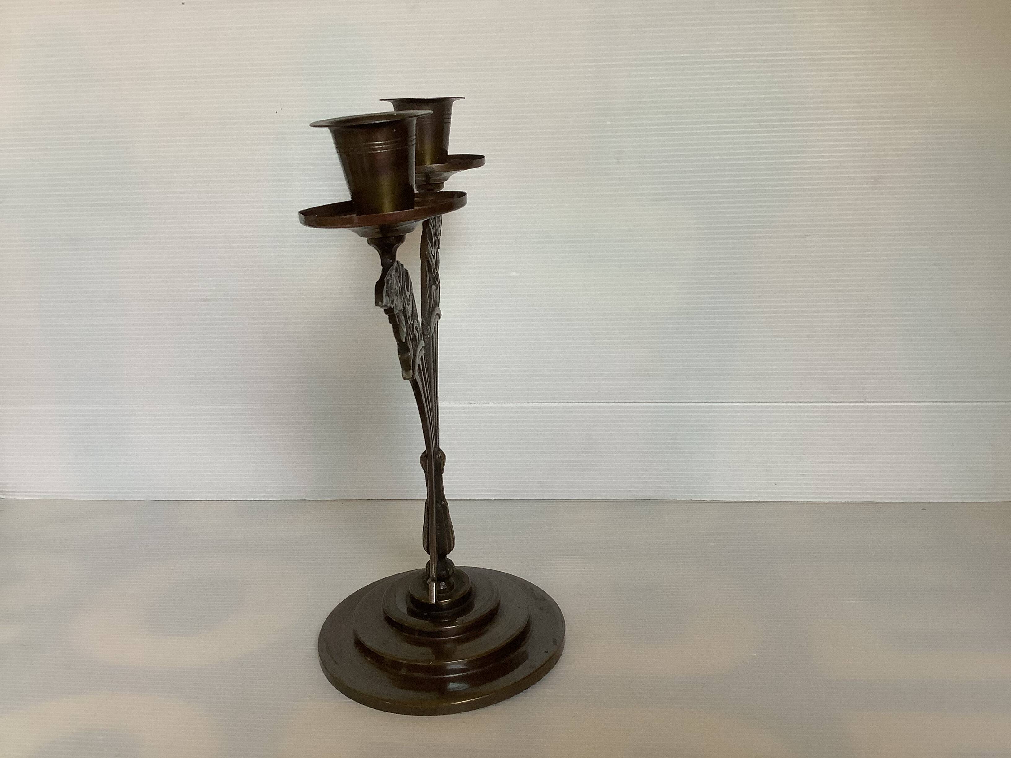 Candle holders in the shape of art deco butterfly wings