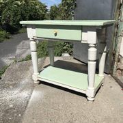 Rustic wooden dining table painted white and pale green, with a central drawer, 1950s.