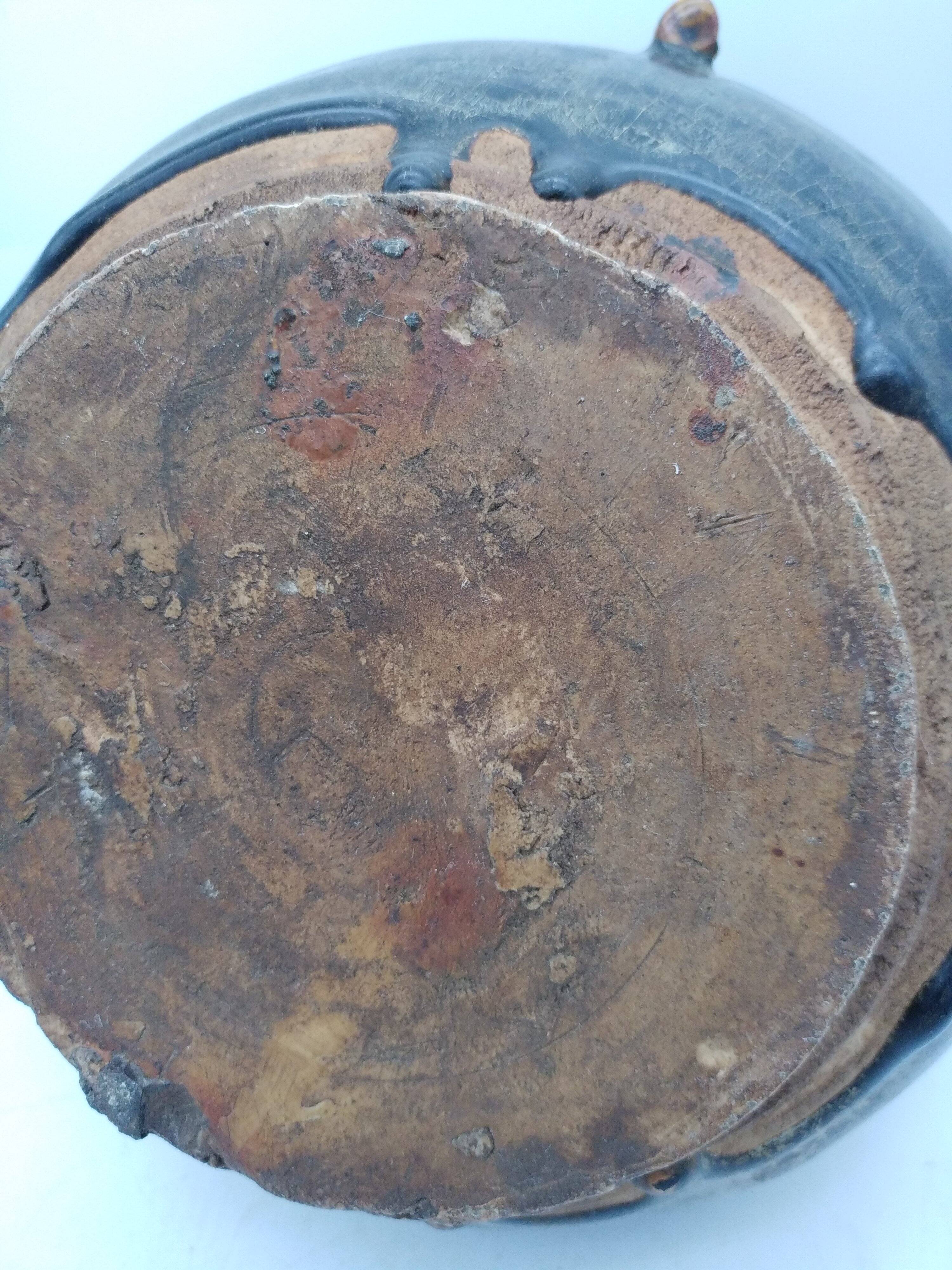 Antique Khmer ceramic vase. With elephant decoration.