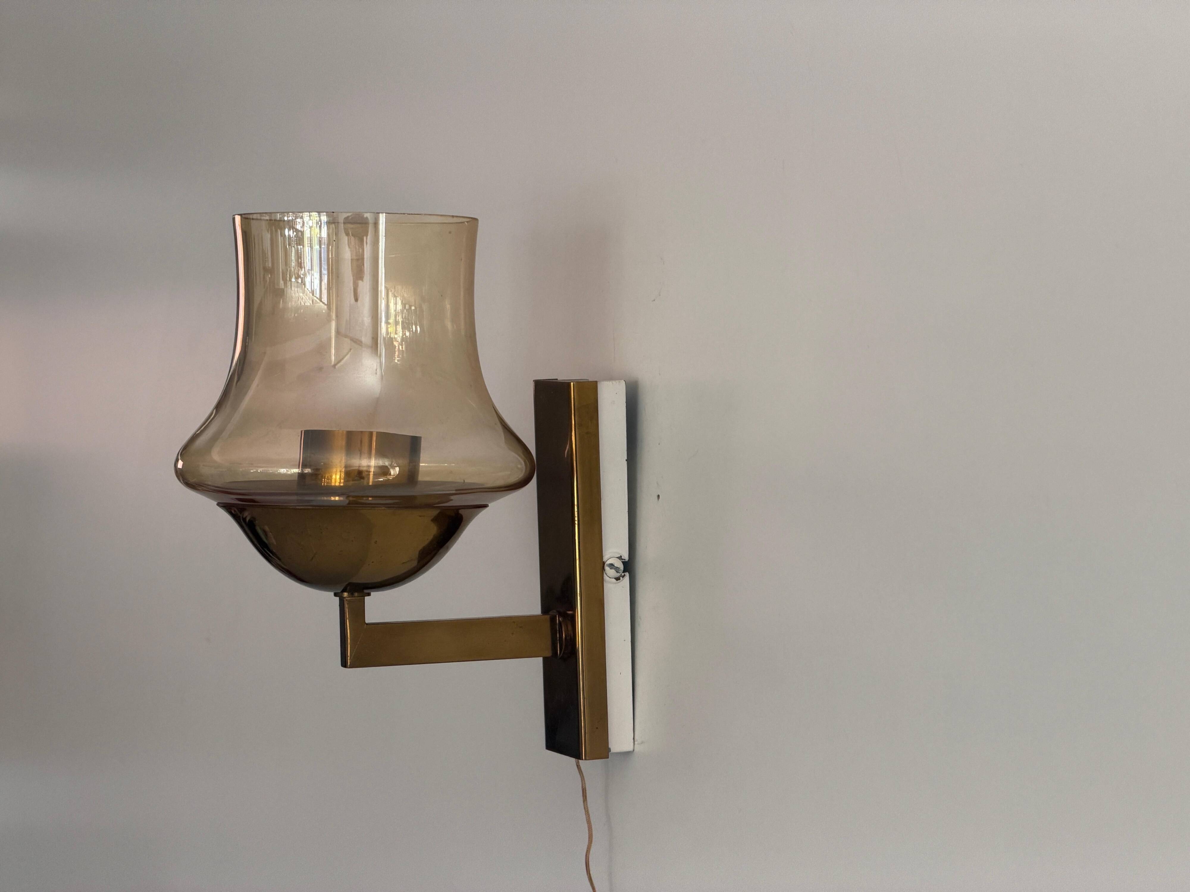 Yellow glass and brass wall light from the mid-century, 1960, Germany.