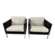 Pair of armchairs by Pierre Paulin for Artifort, black leather and cream fabric.