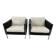 Pair of armchairs by Pierre Paulin for Artifort, black leather and cream fabric.