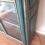 Glass cabinet in green patinated wood