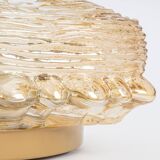 Pairs of amber glass wall lights in the shape of a fingerprint, Germany, 1970s.