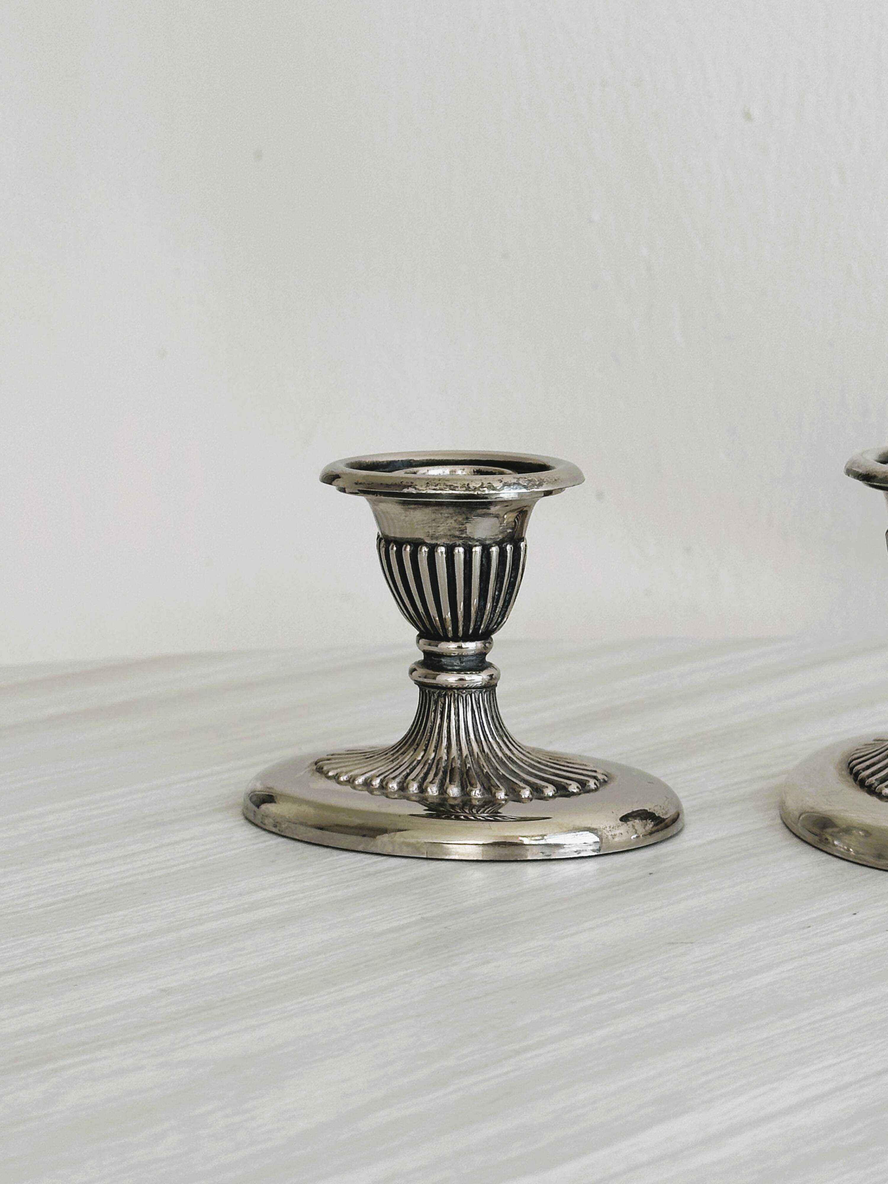 Pair of antique metal candlesticks