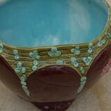 Old earthenware cachepot with flower decoration