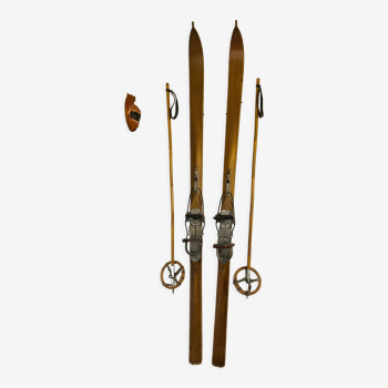 Old wooden ski with poles