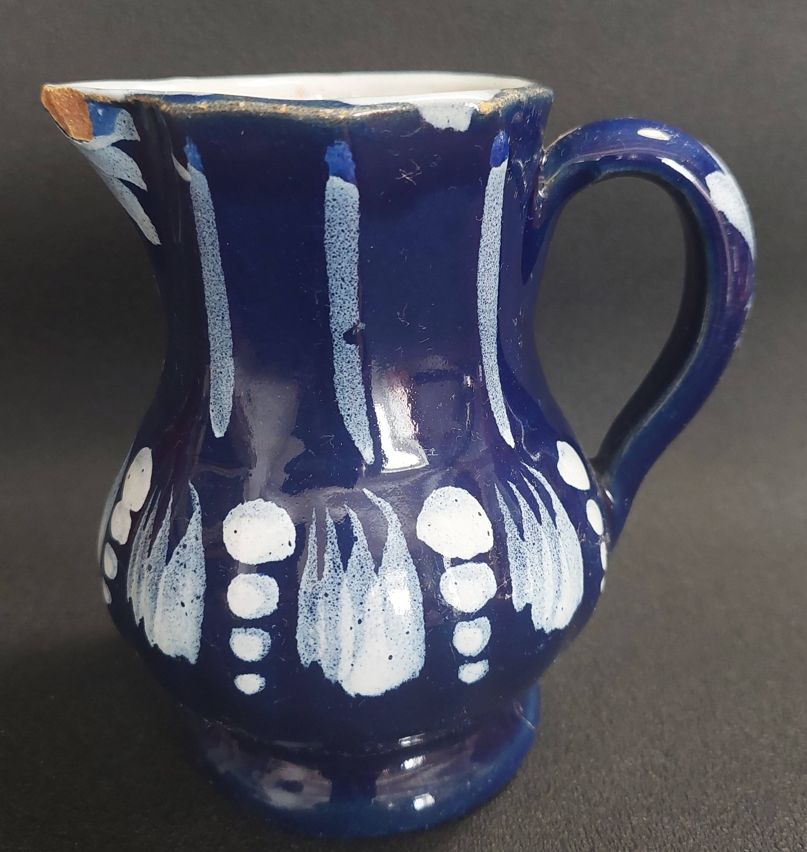 Earthenware pitcher from the North of France with blue covering, 19th century