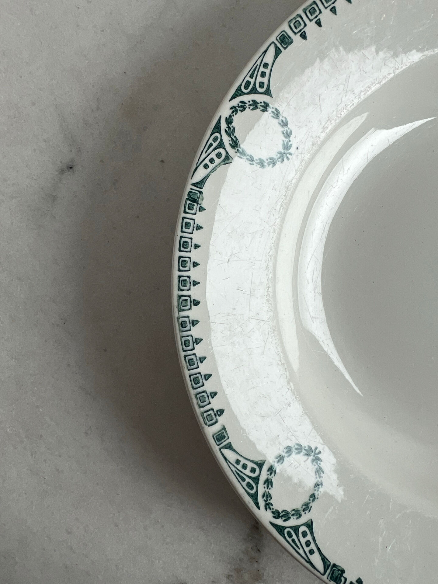 Céranord Saint Amand deep plate with green crown decoration.