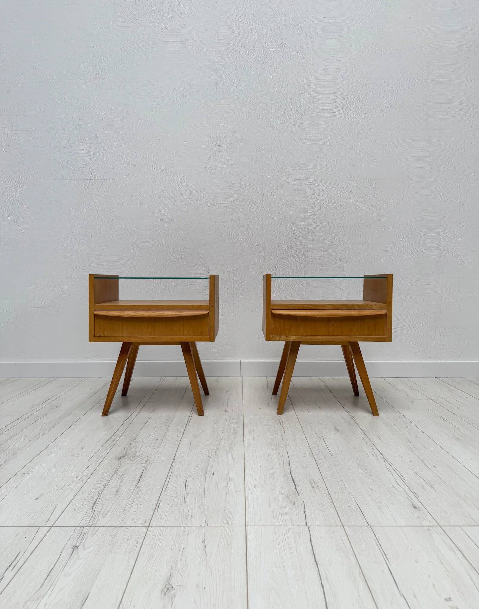 1960s vintage pair of mid-century walnut nightstands with glass shelves