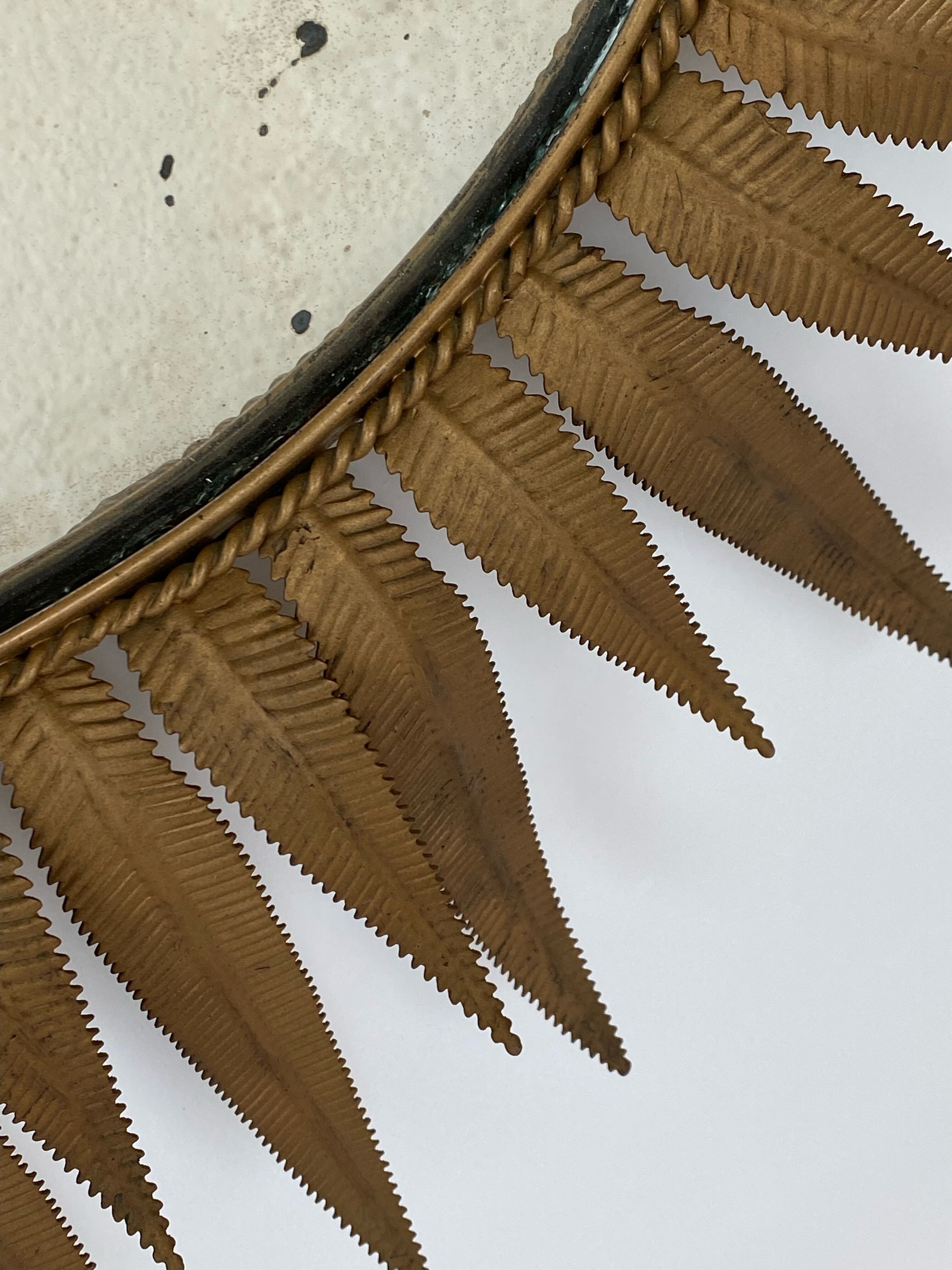 Vintage copper metal sun mirror oval shaped from the 1960s