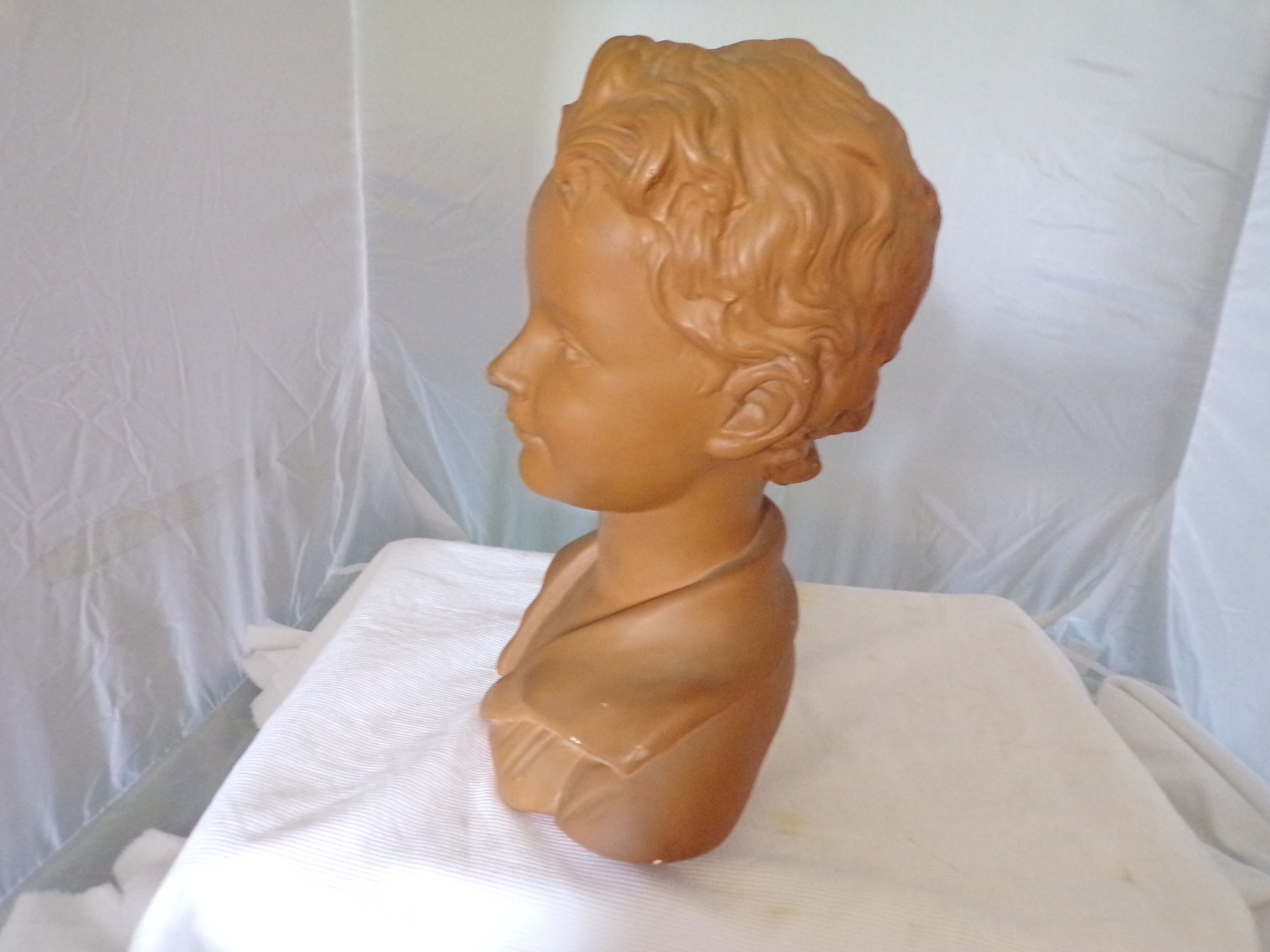 Bust of a young man in plaster