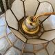 Mother-of-pearl and brass suspension