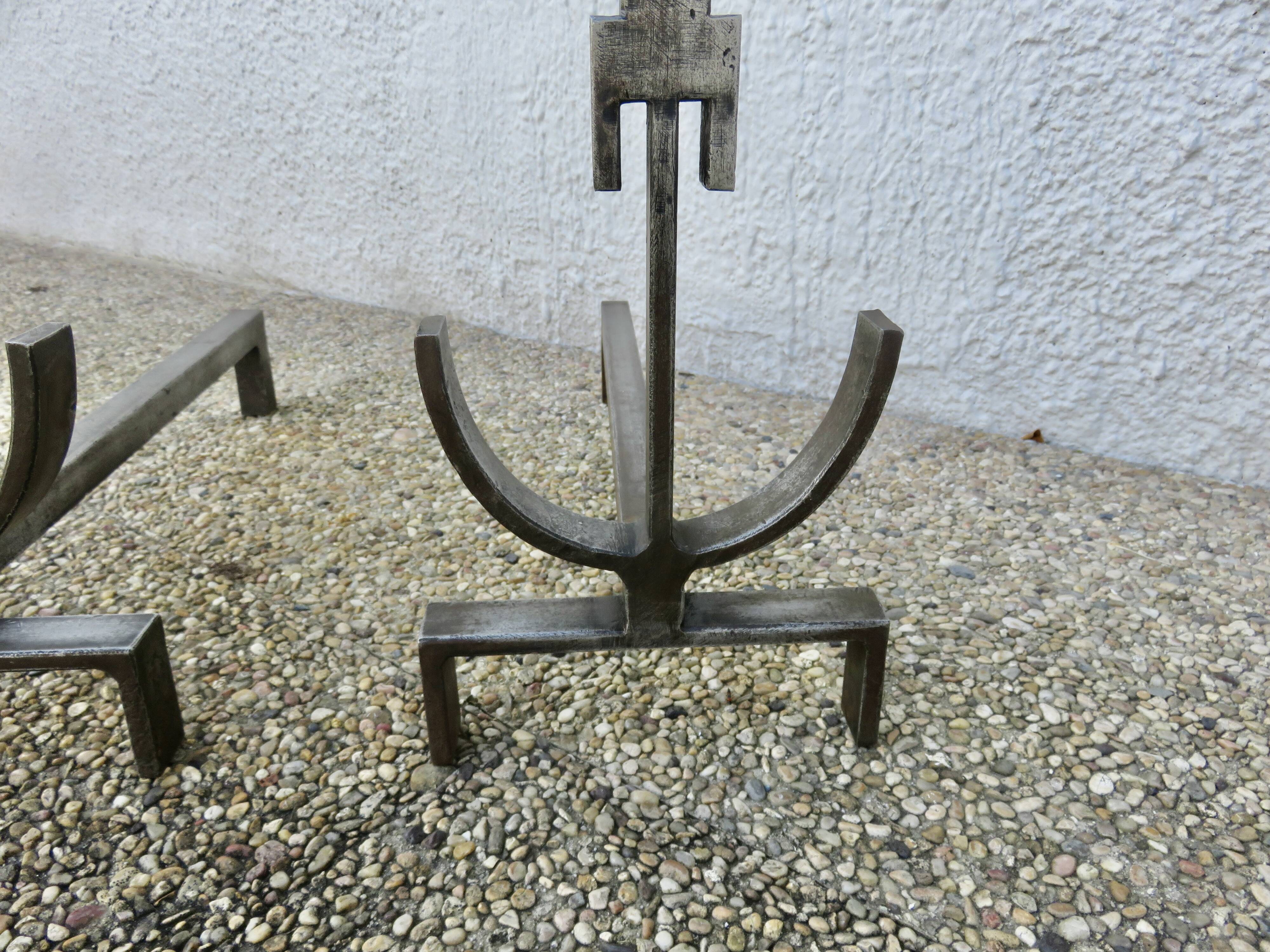 Pair of modernist andirons in forged and hammered steel, French work