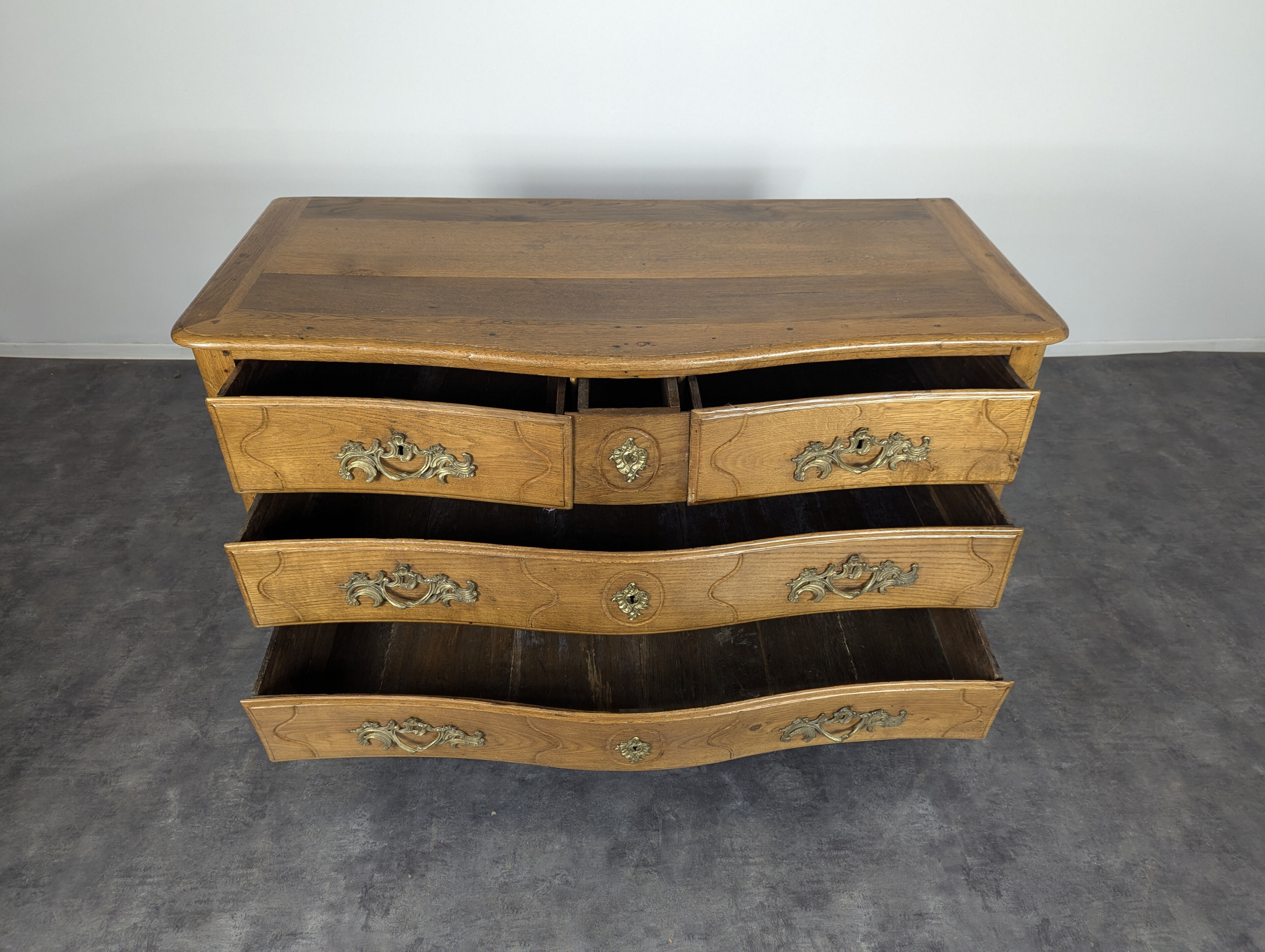 Louis XV period chest of drawers in light oak