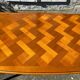 Antique extendable table in cherry wood and marquetry in the Louis XV style.