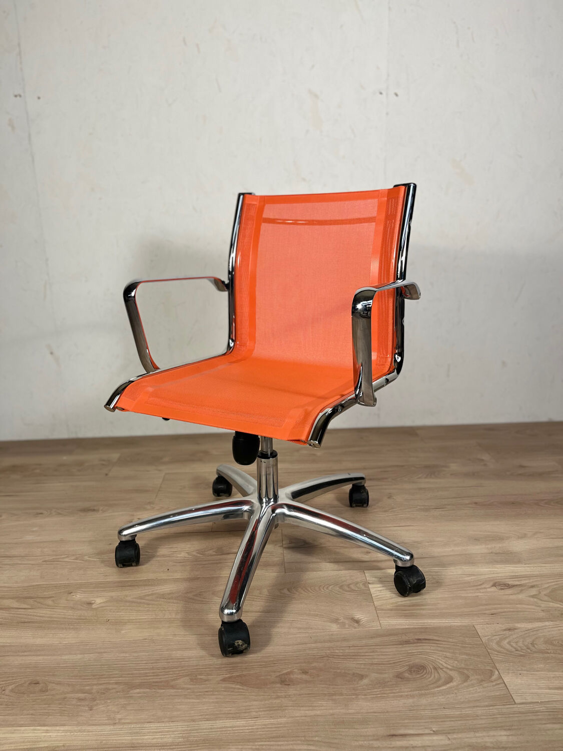 Designer office chair - Orange mesh and chrome base