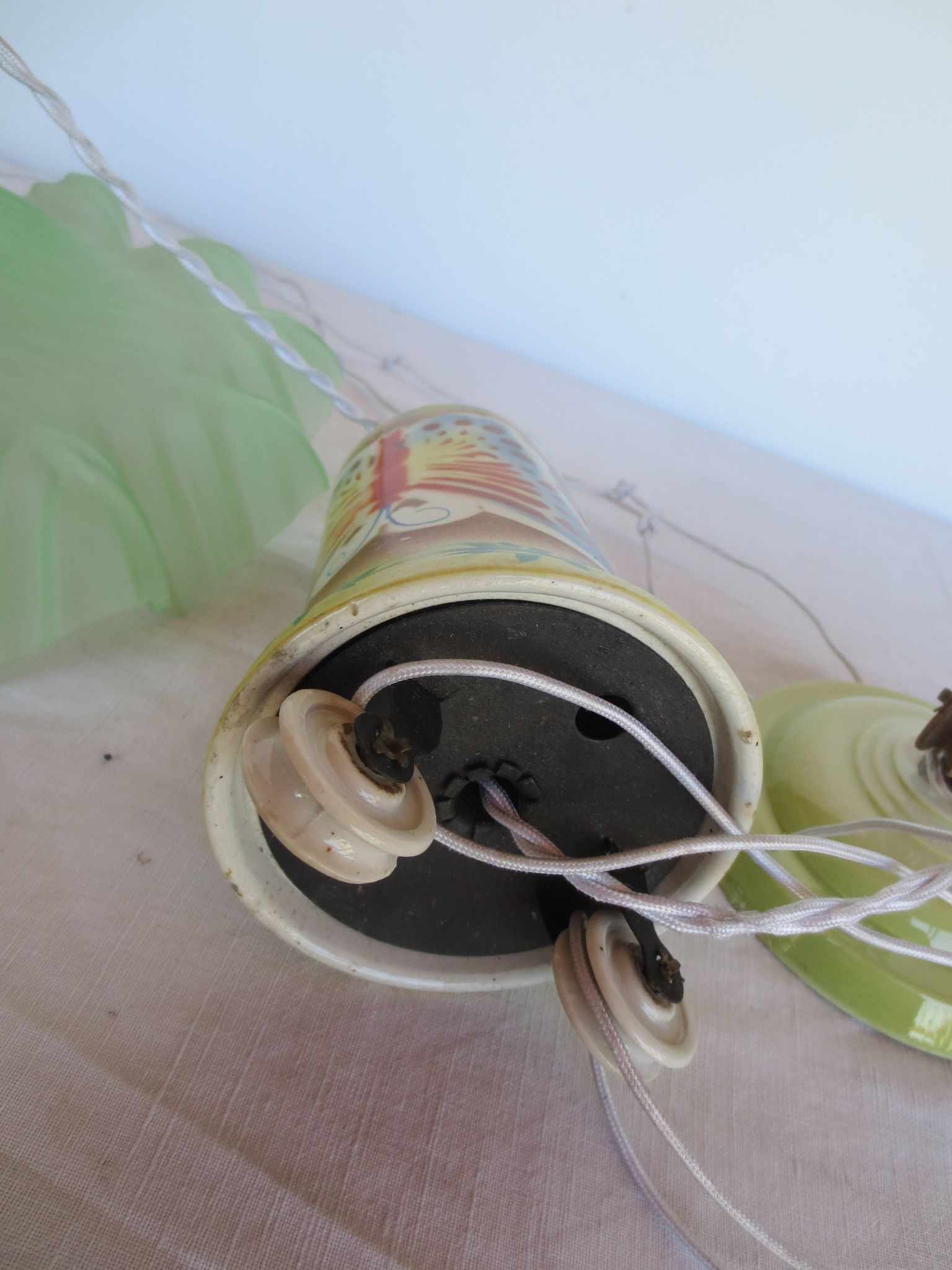 "Very old light fixture" with a "rise and fall" counterweight adorned with butterflies.