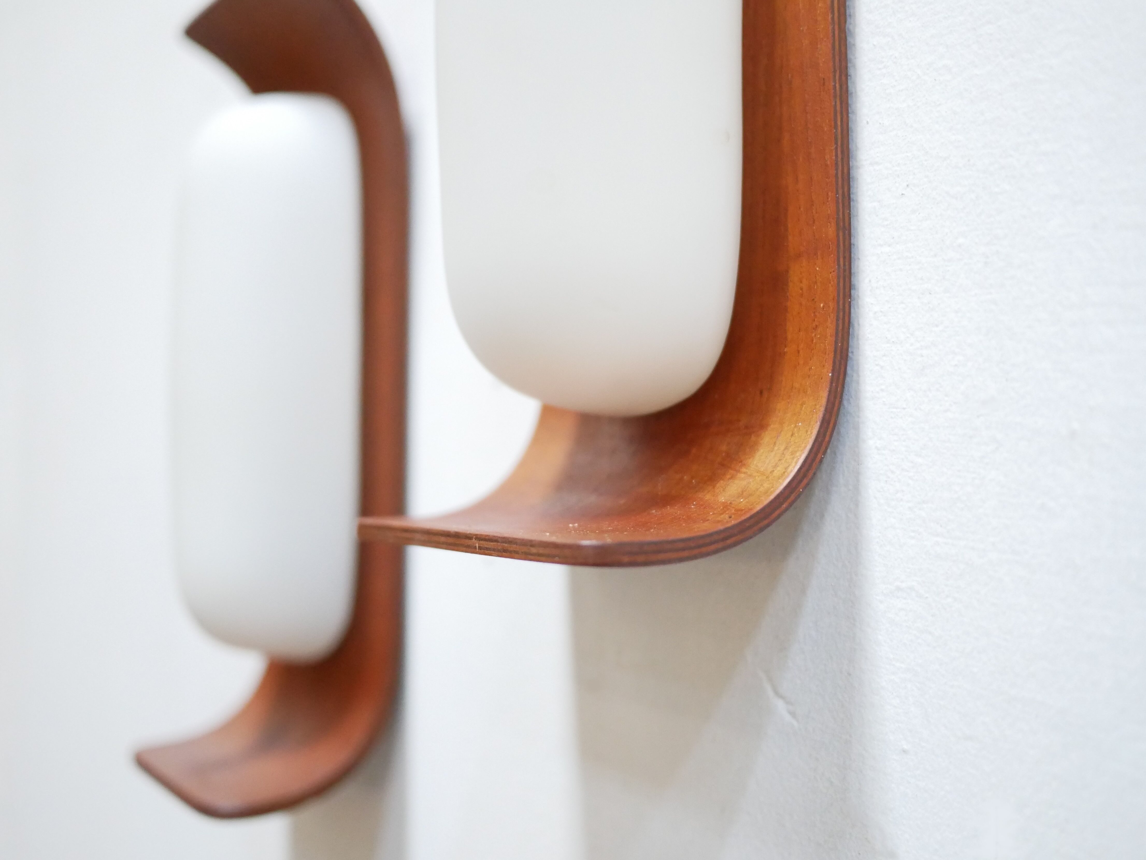 Pair of teak and opaline wall lamps by Goffredo Reggiani
