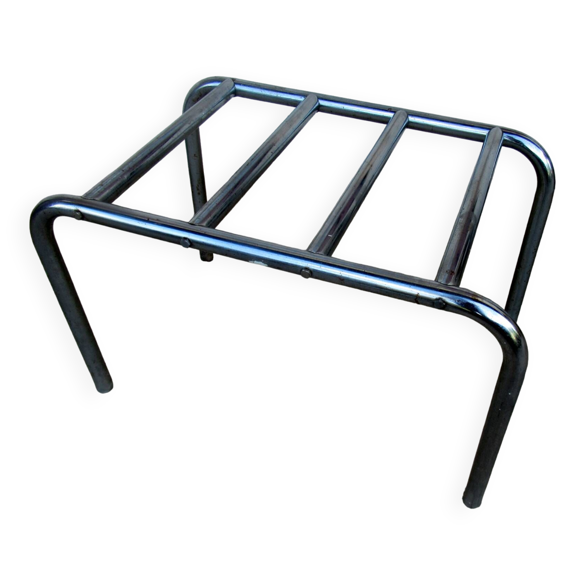 Hotel luggage rack, in chrome steel. The 50's