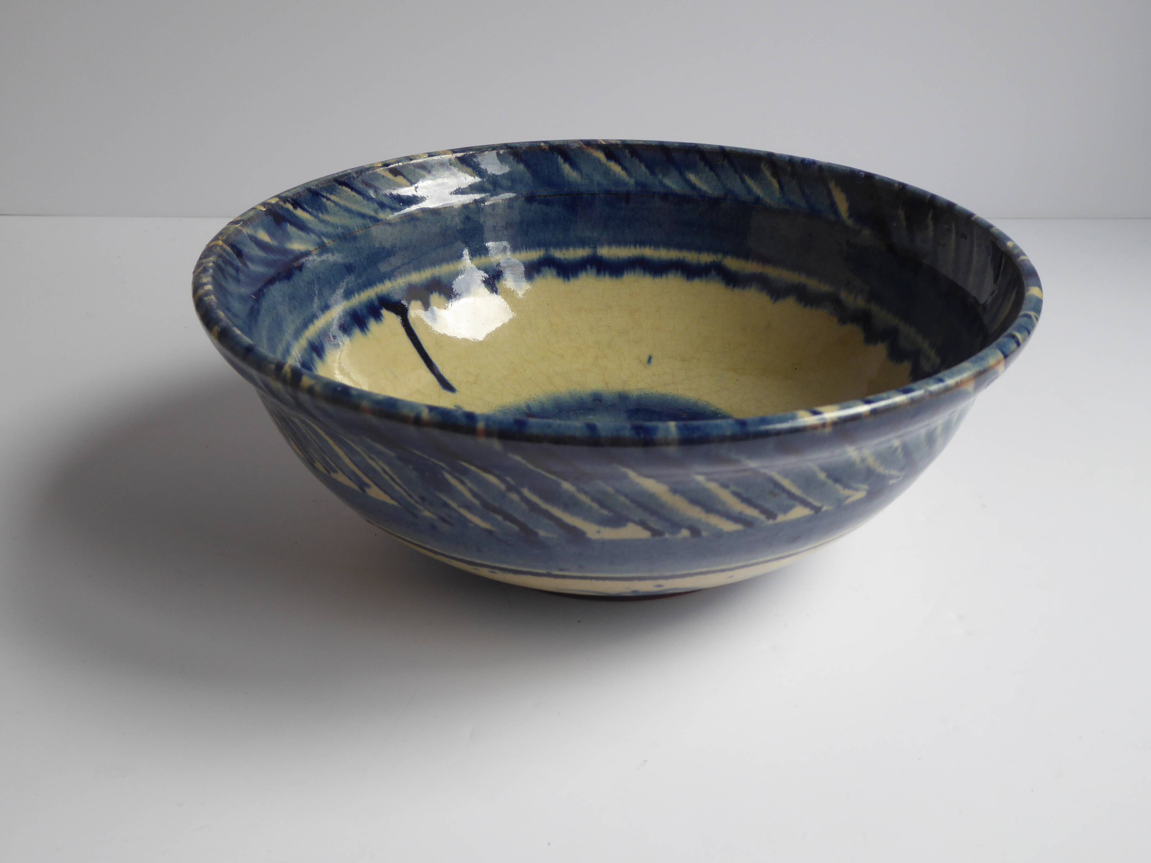 Blue enamelled terracotta cup