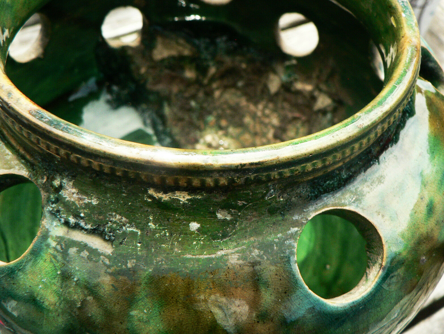 details on old bulb pot in glazed earthenware