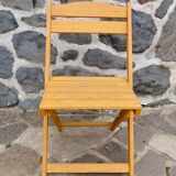 Pair of folding chairs in blond wood