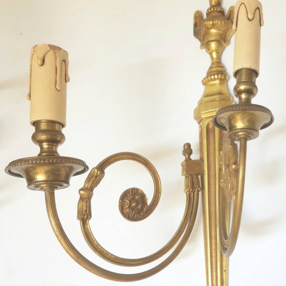 Pair of bronze wall sconces in Louis XVI style