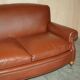 Edwardian leather club canapé circa 1910 with feather cushions.