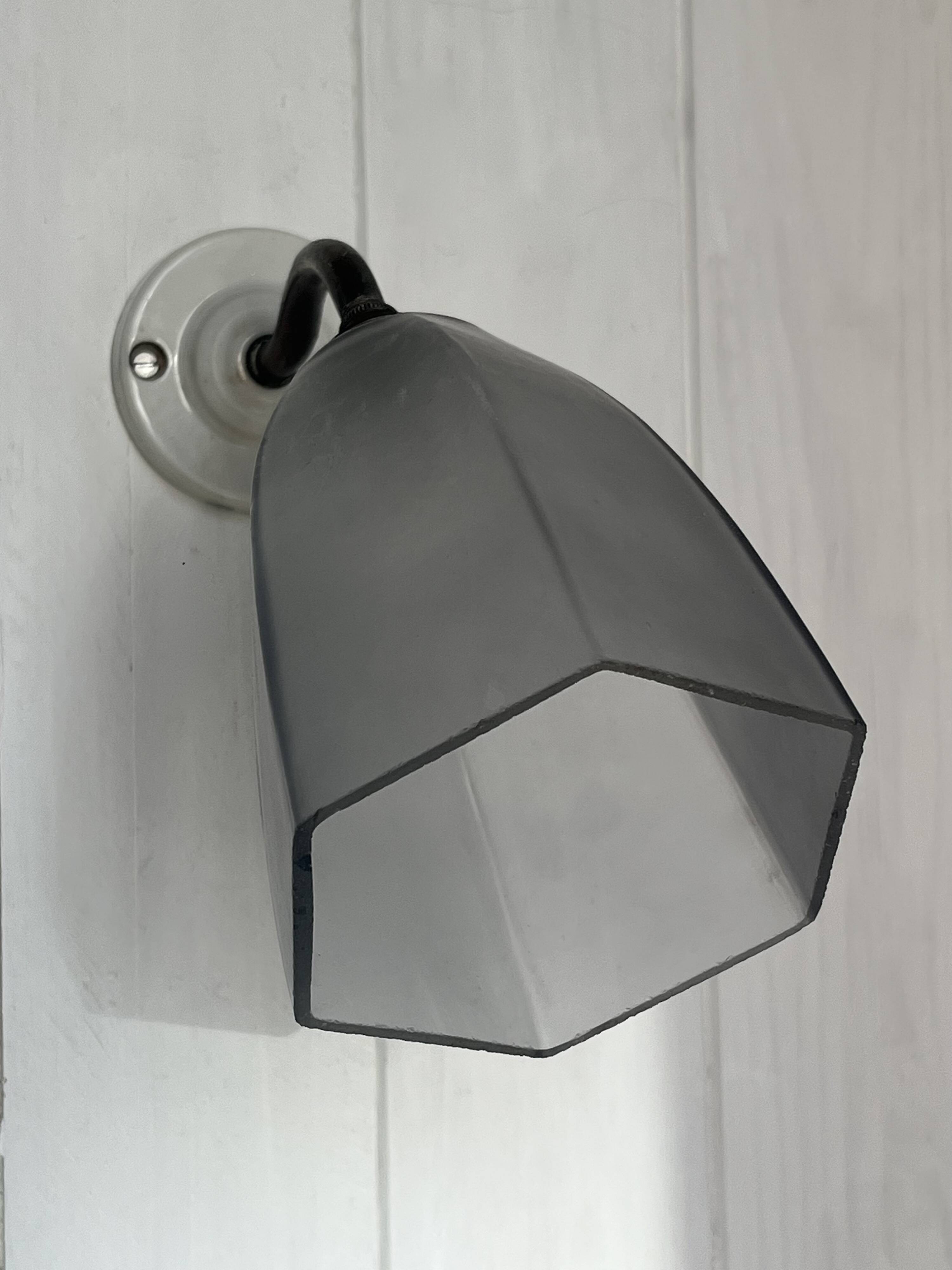 Swan neck wall light on porcelain base