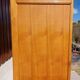 Vintage wardrobe with mirror and tapered legs.
