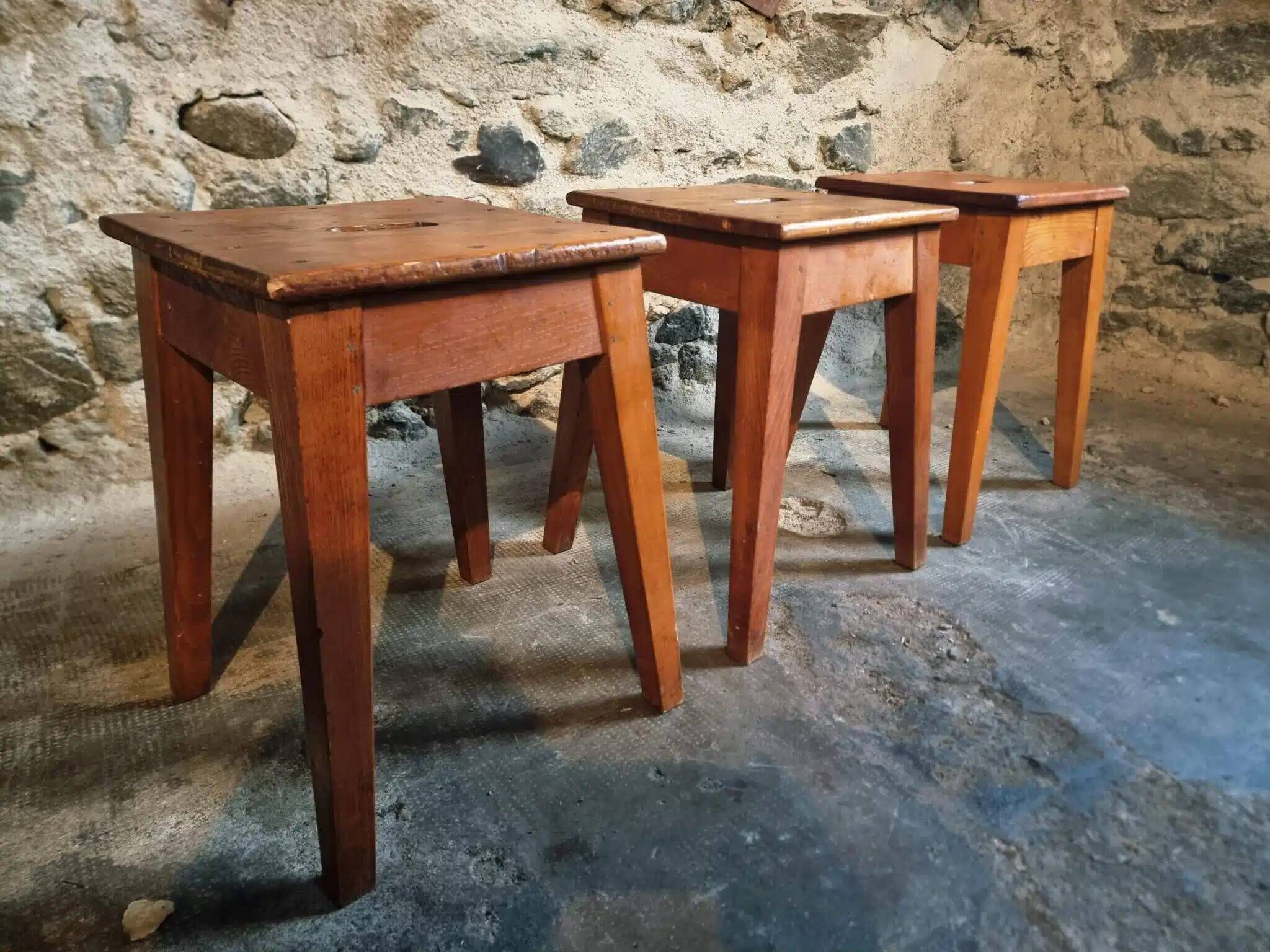 Set of 3 vintage French wooden stools from the 1950s.