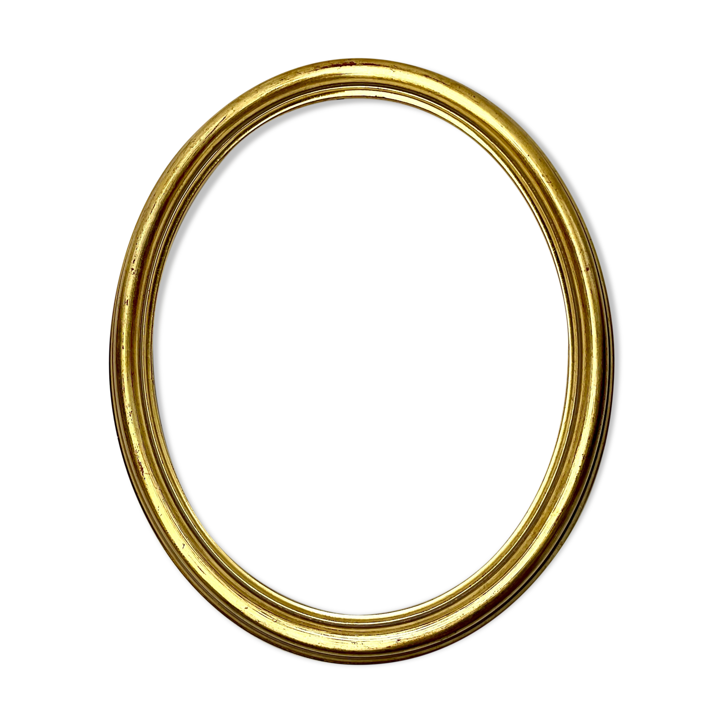 Old oval gilded wooden frame with domed glass