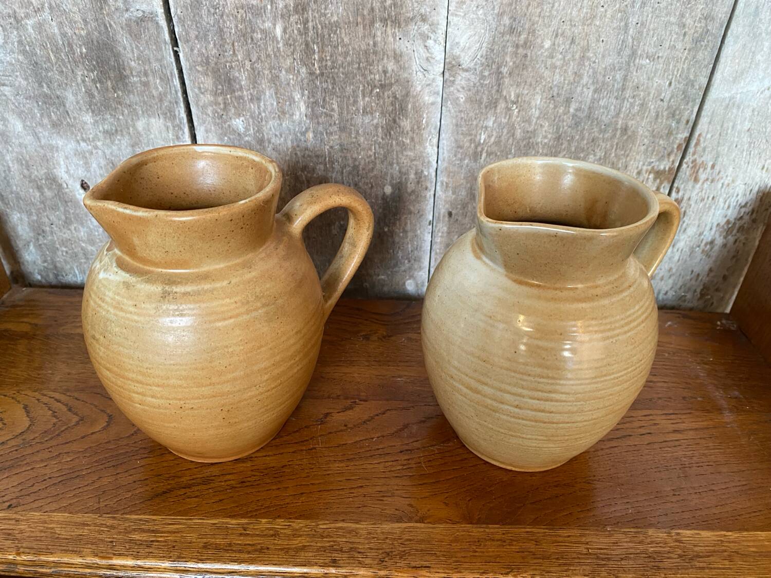 Pair antique cnp village beige & cream stoneware pitchers vintage