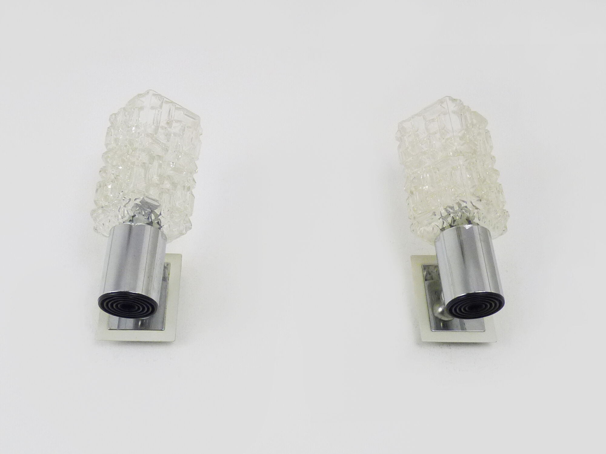 Pair of space age wall sconces, stainless steel and thick glass, 60s 70s