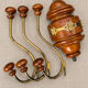 Antique wall coat rack in turned wood and gilded metal, circa 1900-1930.