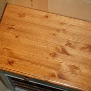 Vintage wooden furniture for 45 wine bottles with a drawer.