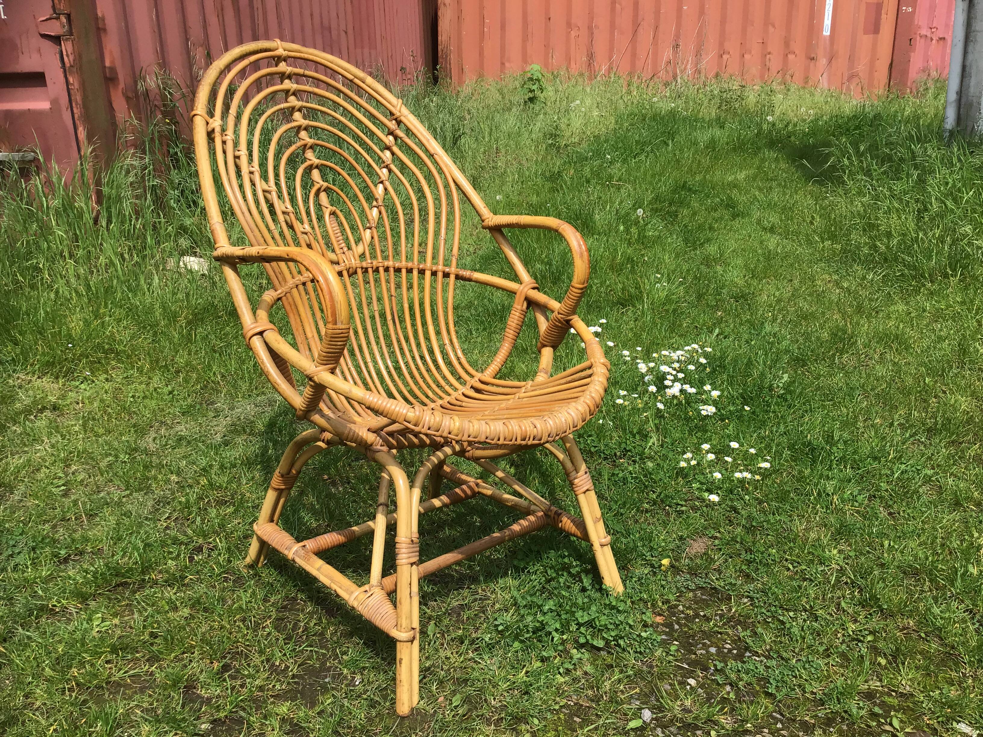 Vintage ovoid-shaped rattan armchair.