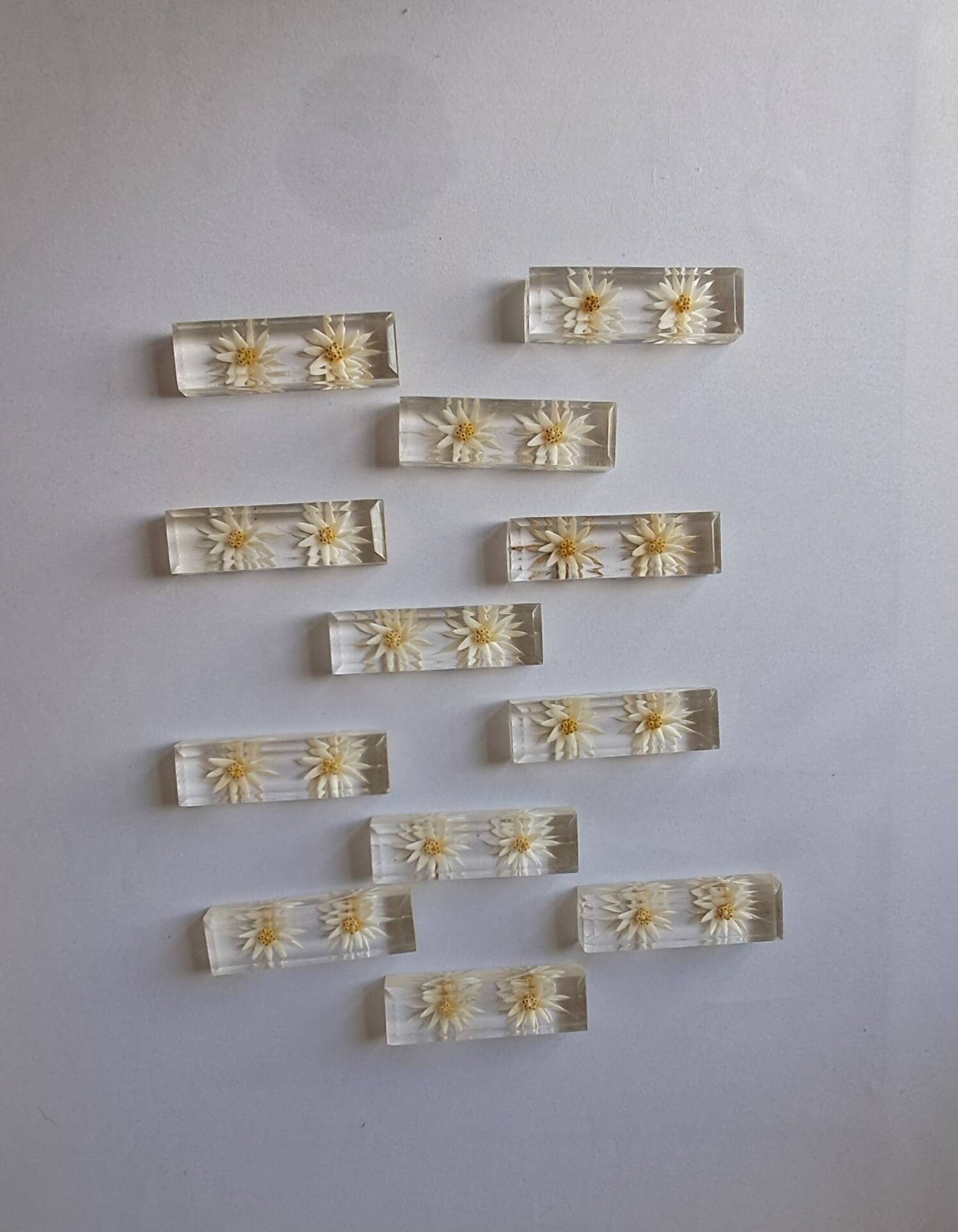 12 knife rests with resin inclusion. 1970s.