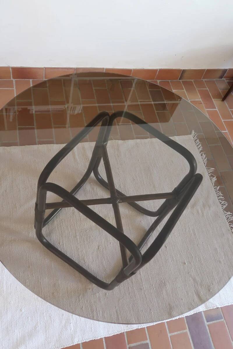 Round dining table in rattan, smoked glass top, 1970s.