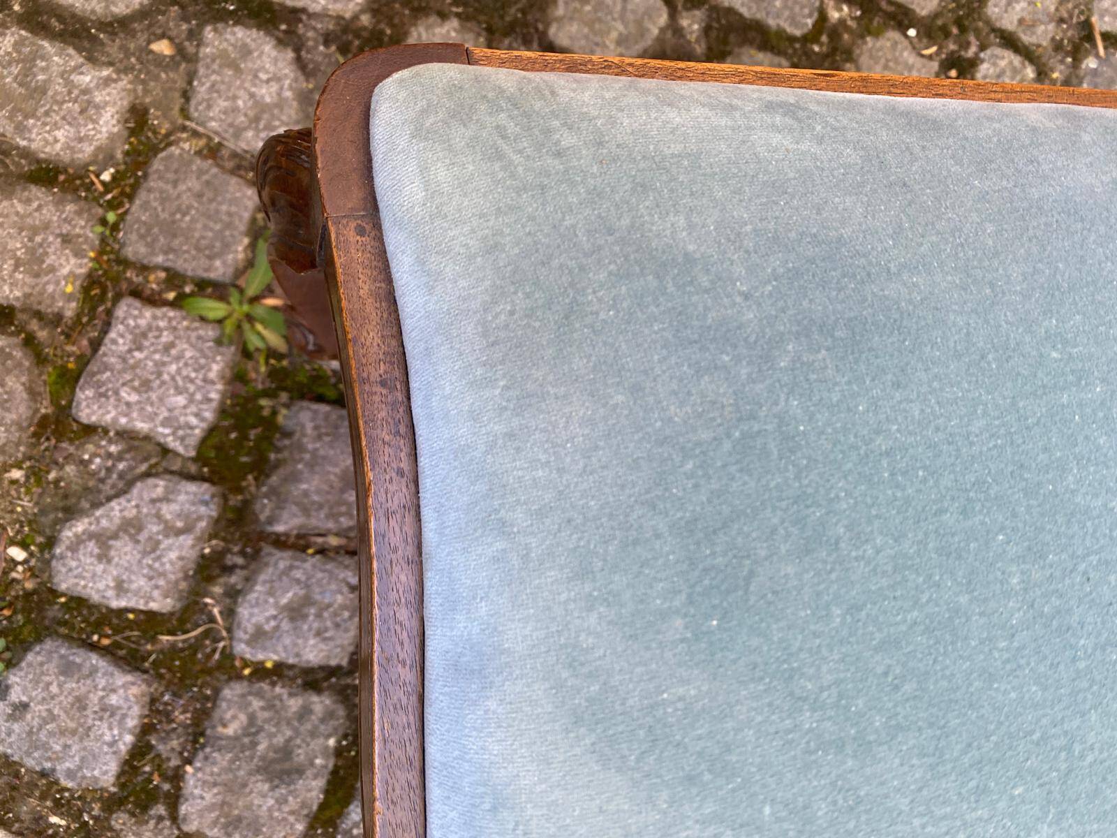 Vintage Louis XV chair made of carved solid wood with blue velvet fabric.