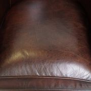 luxury dark leather club chair with English-style ball feet